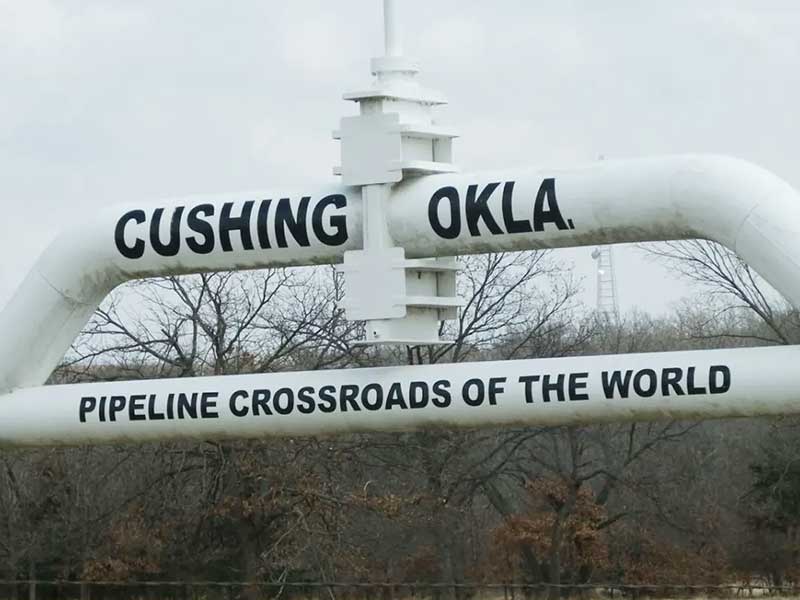 Photo of Oil pipe with the words Cushing OK, Oil Crossroads of the World